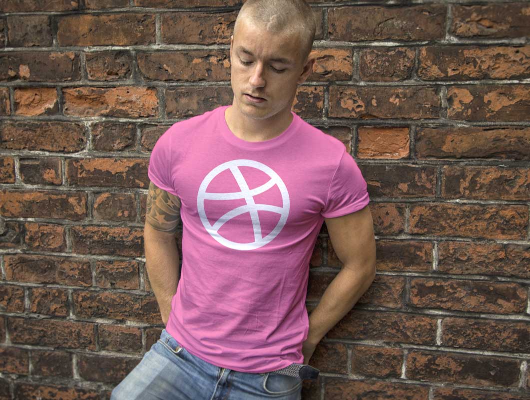 Male wearing t-shirt leaning on brick wall psd mockup