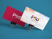 Corporate Business Cards Propped On Binder Clips PSD Mockup