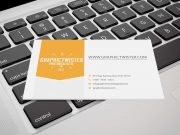 Business Card Laying On Keyboard PSD Mockup