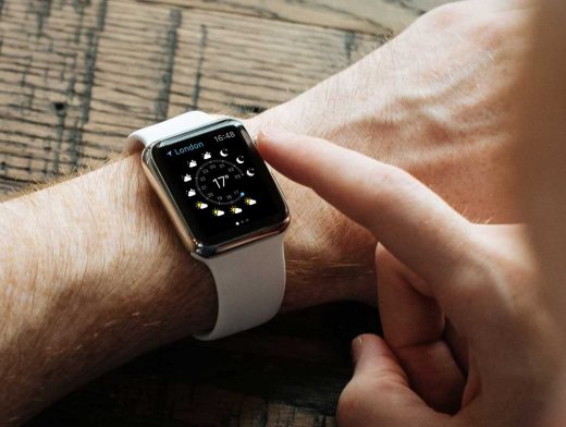 Apple Watch With White Wrist Band In Action PSD Mockup
