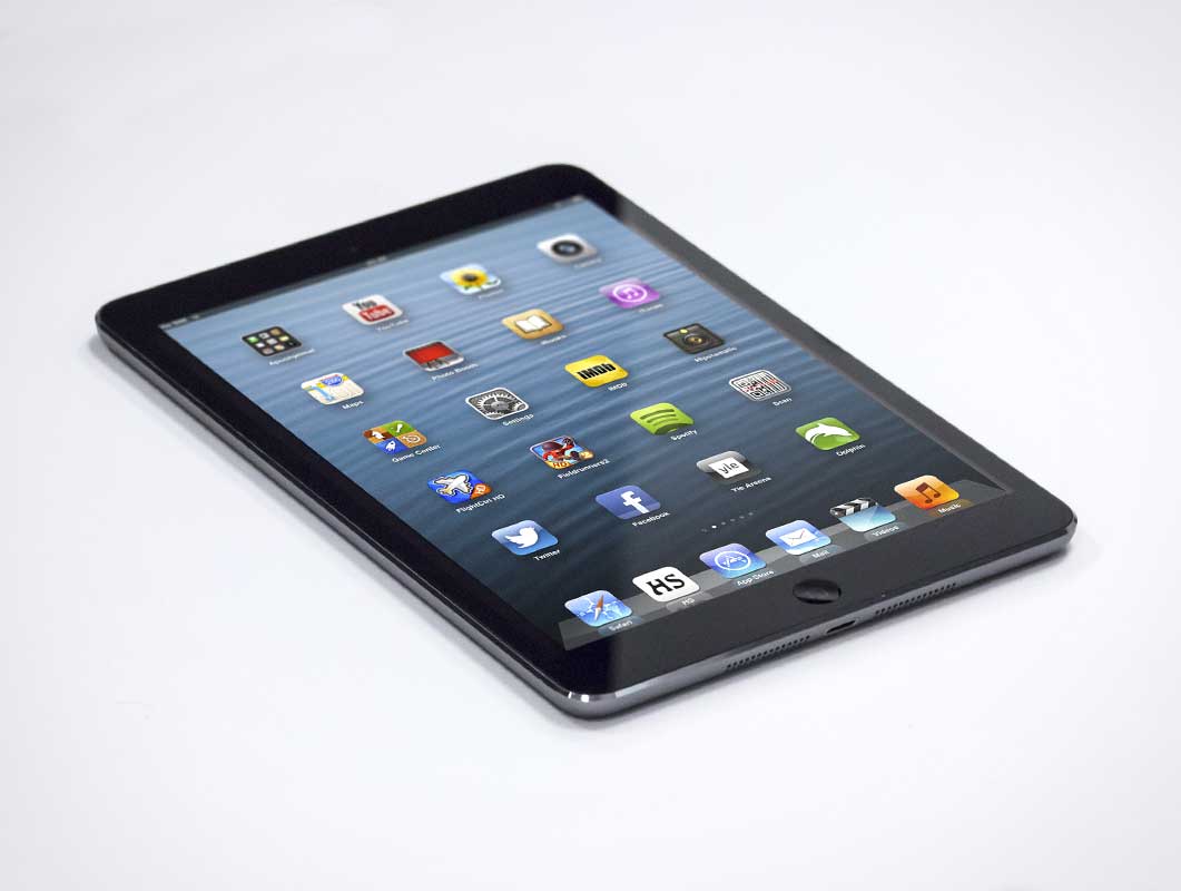 iPad Mini Photo On Flat White Surface PSD Mockup