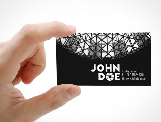Business Card Front Held In Hand PSD Mockup