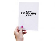 Hand Holding Paper Stencil Cutout PSD Mockup