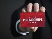 Business Card In Hand Front Face PSD Mockup