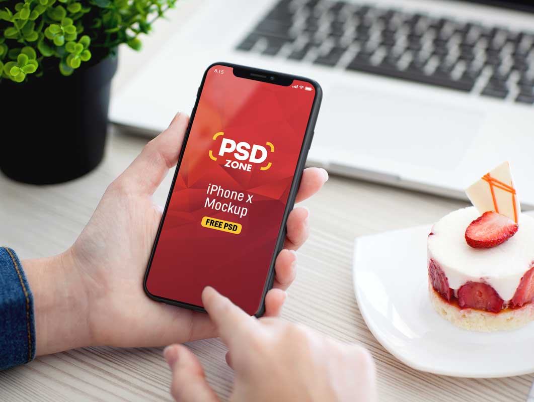Person Operating iPhone X In Hand PSD Mockup