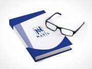 Closed Hardcover Book Front & Reading Glasses PSD Mockup