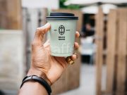 Man Holding Paper Coffee Cup PSD Mockup