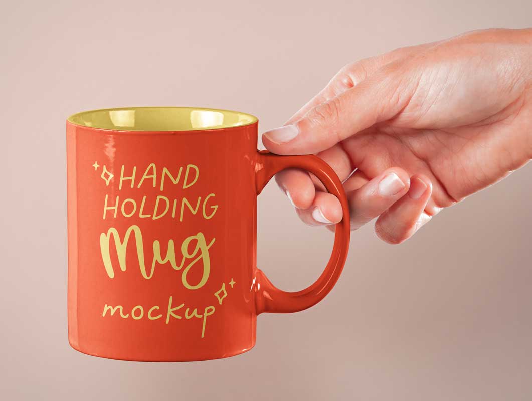 Hand Holding Ceramic Coffee Mug PSD Mockups